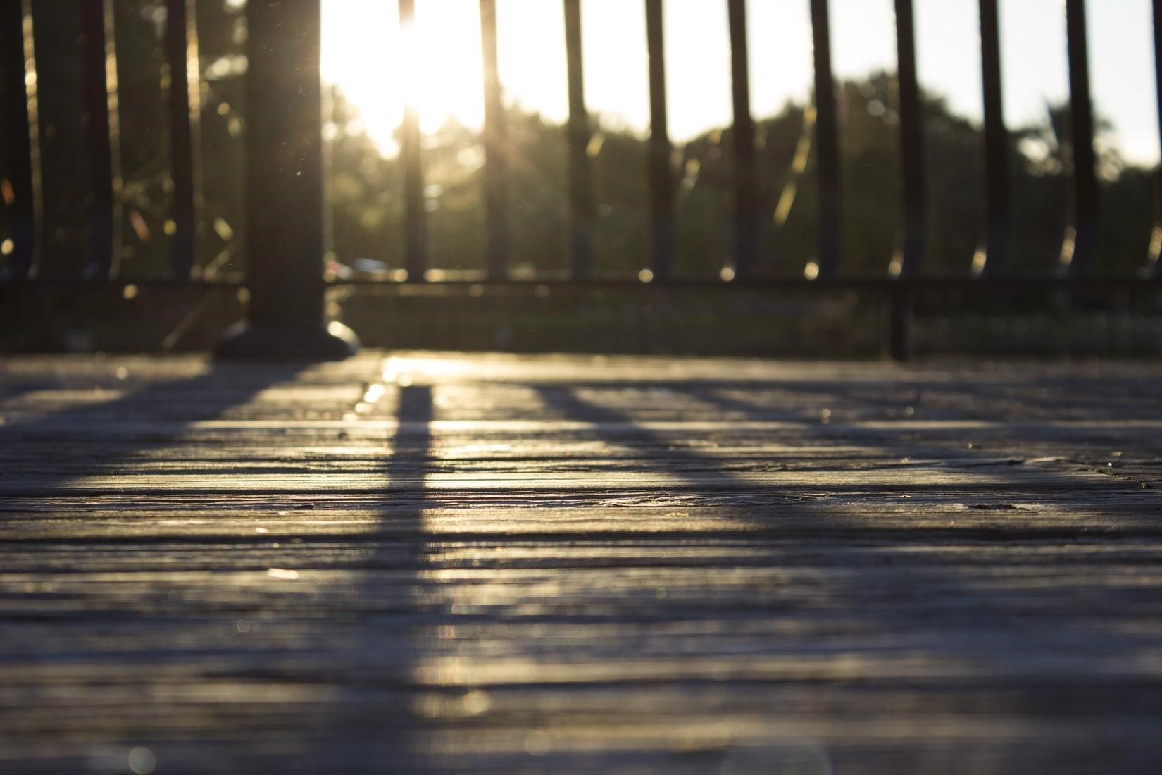 closeup of a wooden deck with sunset