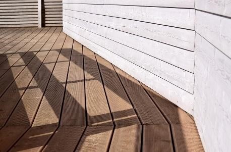 wooden deck fitting smoothly against outside walls