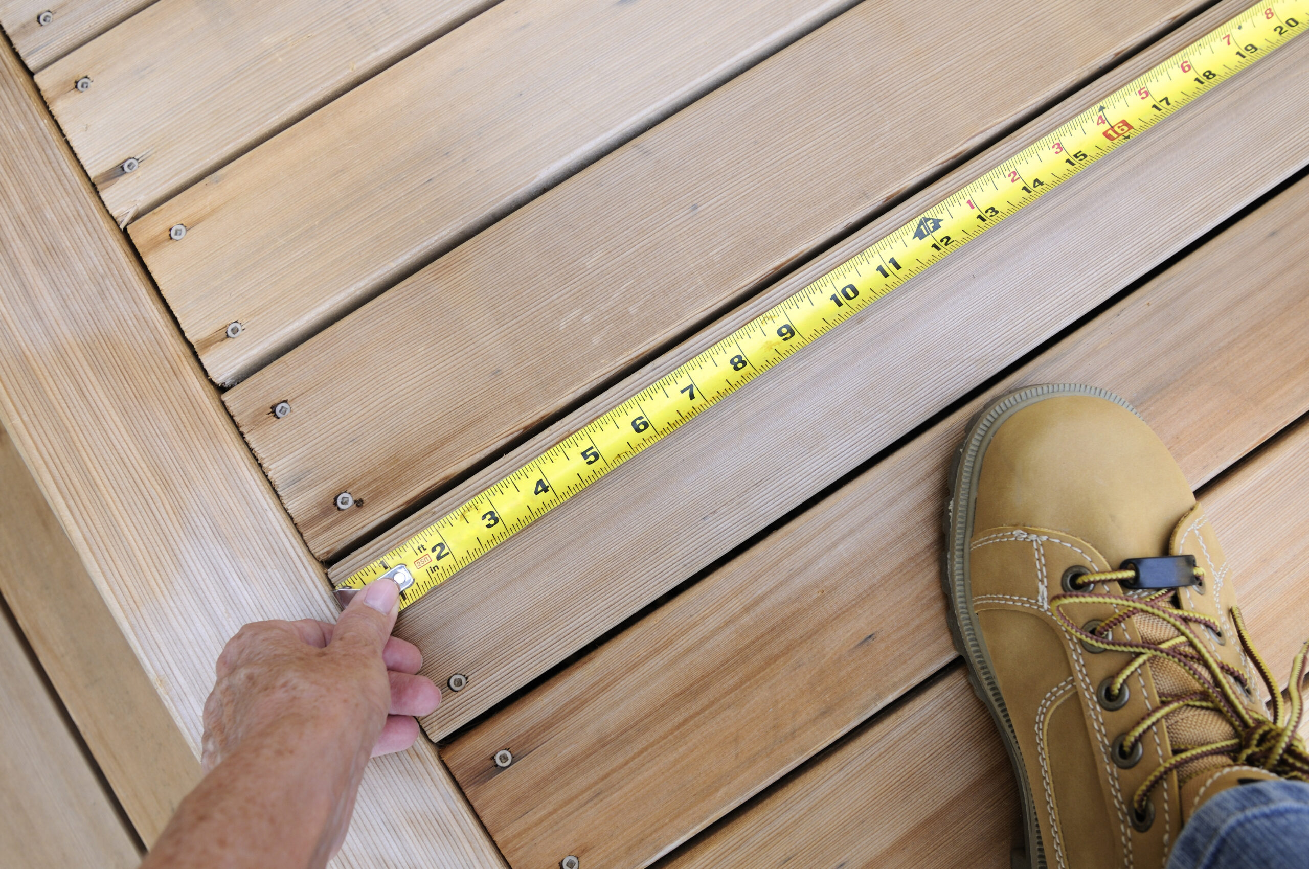 tape measure on a wooden deck