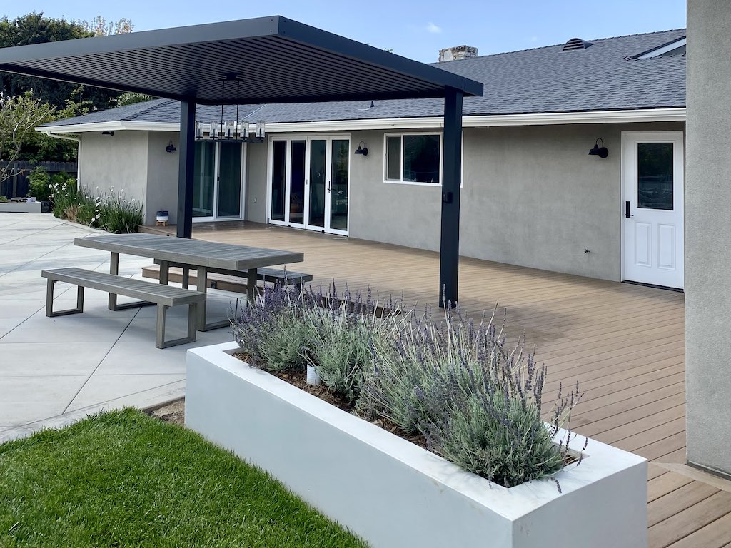 Beautiful pergola, planter, and deck by MG Construction & Decks