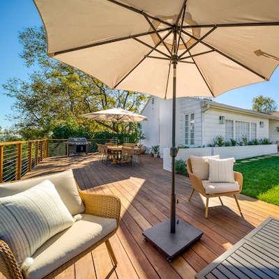 Inviting seating area atop a custom-crafted deck with umbrellas