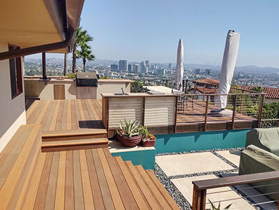 beautiful custom deck overlooking a sunny cityscape