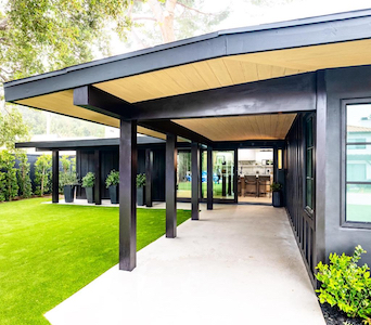 Stylish pergola by MG Construction & Decks perfectly matching a home's architecture
