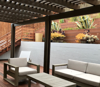 High quality pergola by MG Construction & Decks accentuating a recessed backyard deck