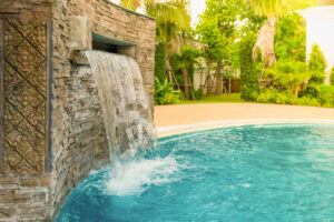 Small artificial waterfall in the swimming pool