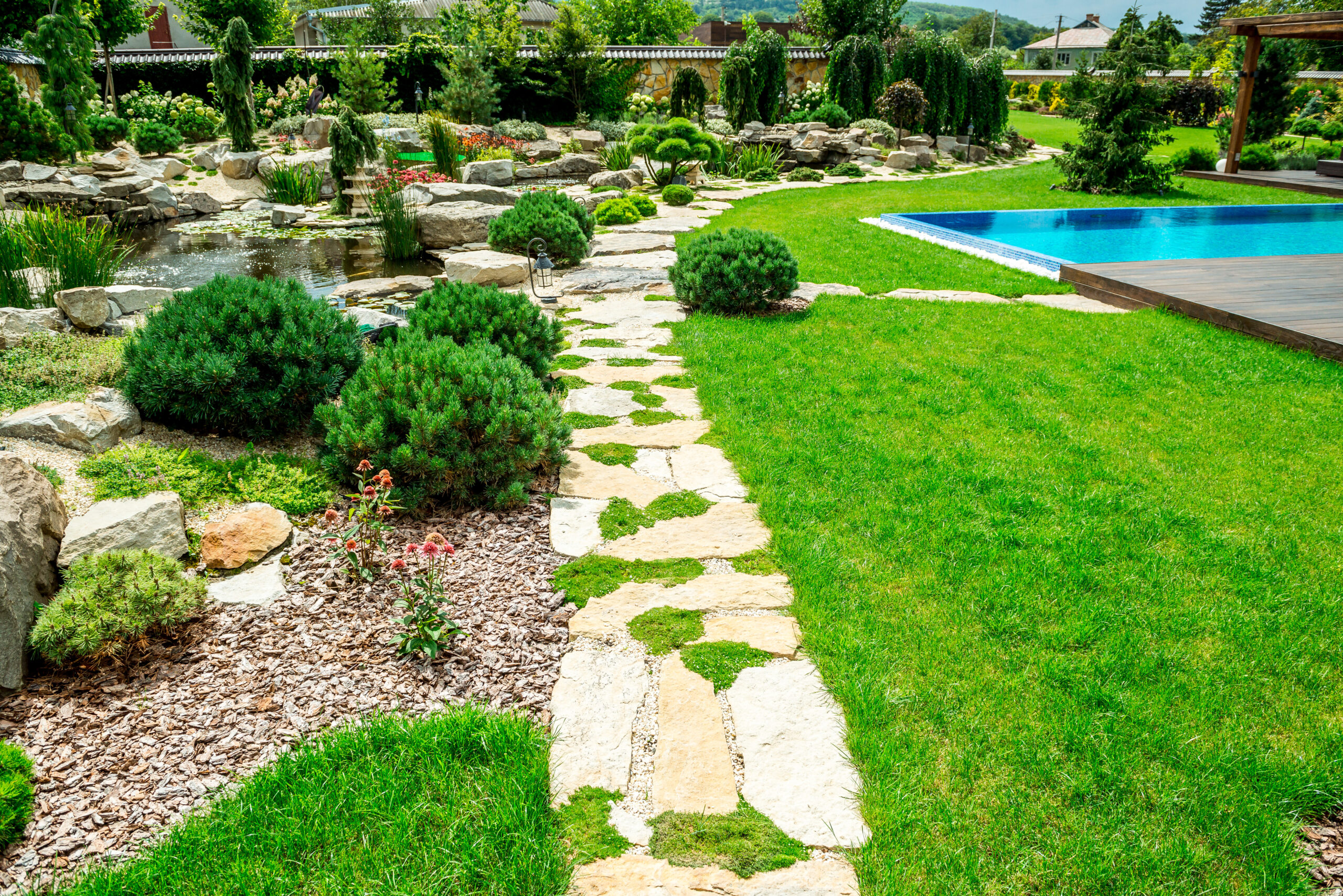 A country house with a beautiful courtyard behind the house and a swimming pool, landscape design